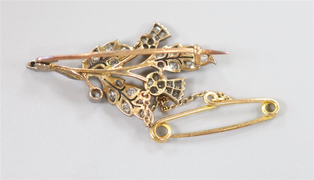 A Victorian yellow metal and diamond set thistle brooch, 35mm, gross 4.4 grams.